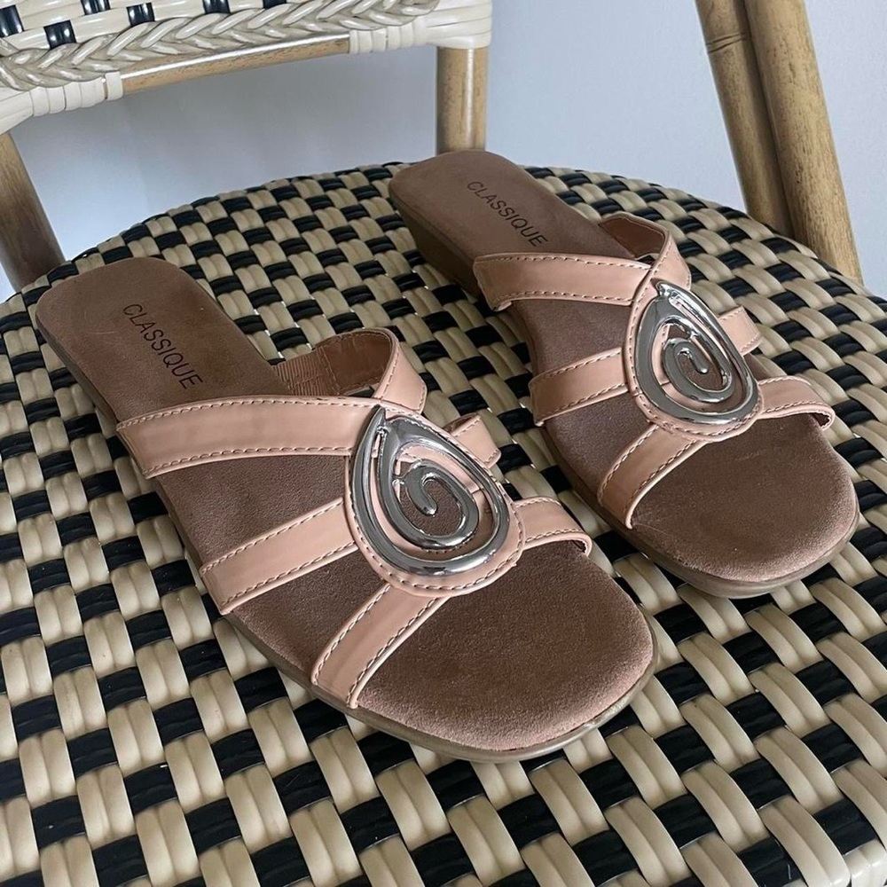 Tan strappy sandals with silver swirl pendant size: 9